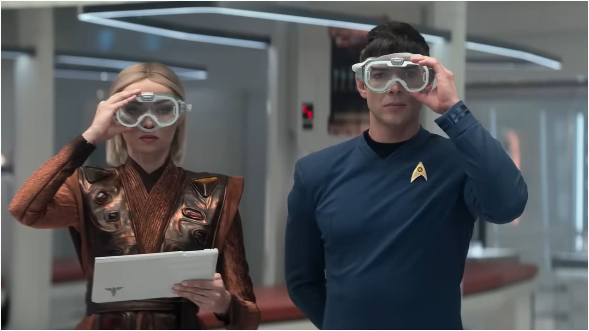 A glimpse from the Star Trek: Strange New Worlds season 3 trailer shows Jess Bush and Ethan Peck in medical attire, preparing for a high-tech procedure aboard the Enterprise. (Image via Paramount+)